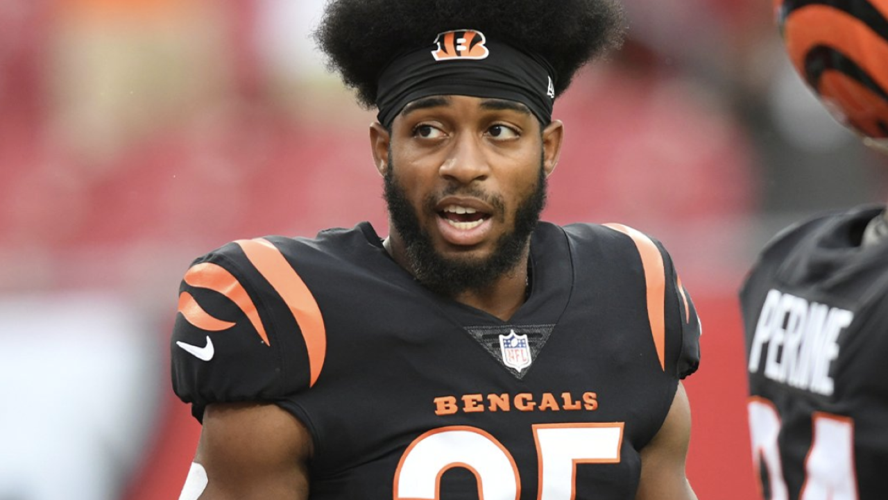 Cincinnati Bengals defensive end Joseph Ossai drops Tampa Bay Buccaneers  quarterback Tom Brady for his first preseason sack