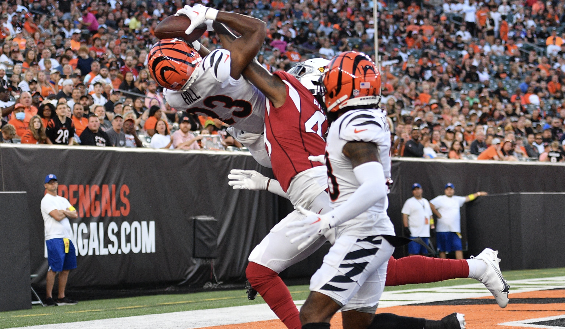 Tariqious Tisdale and Joseph Ossai of the Cincinnati Bengals look